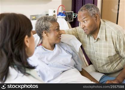 Doctor Explaining,Senior Couple Looking At Each Other