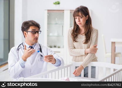 Doctor explaining to young mother
