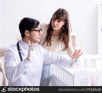 Doctor explaining to young mother. The doctor explaining to young mother