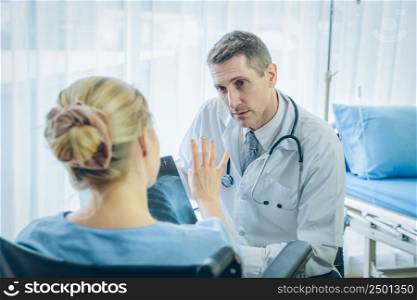Doctor explaining x-ray results to patient at hospital,Corona virus covid pandemic warning concept,2019-nCoV.
