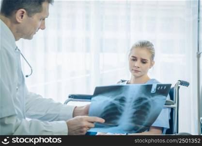 Doctor explaining x-ray results to patient at hospital,Corona virus covid pandemic warning concept,2019-nCoV.