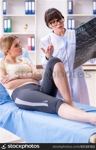 Doctor explaining x-ray scan during consultation