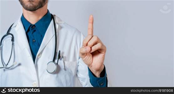 Doctor finger pointing up with text space. Unrecognizable doctor pointing up, Hand of doctor pointing up