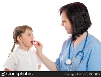 doctor gives a pill to little girl
