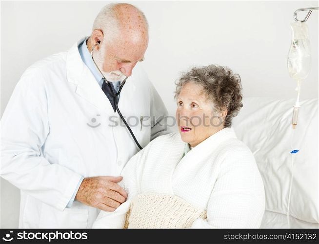 Doctor gives his hospital patient a medical examination.