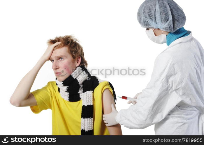 Doctor giving an injection to a young men in the doctors office