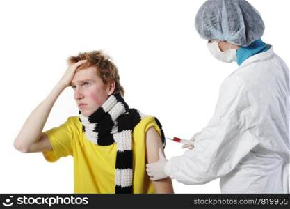 Doctor giving an injection to a young men in the doctors office