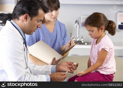 Doctor Giving Child Injection In Doctor&#39;s Office