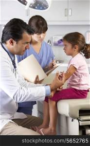 Doctor Giving Child Injection In Doctor&#39;s Office