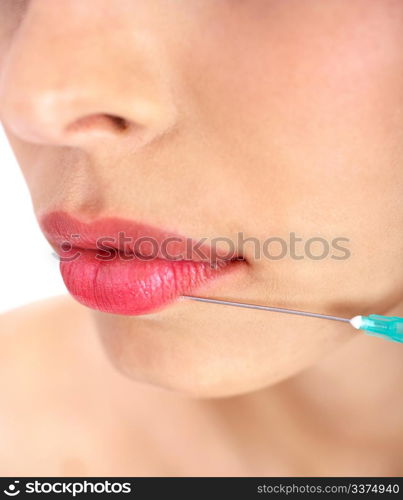 Doctor giving injection on face of a young girl on her upper lip over isolated white baclground