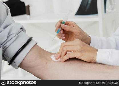 doctor giving iv injection. Resolution and high quality beautiful photo. doctor giving iv injection. High quality beautiful photo concept