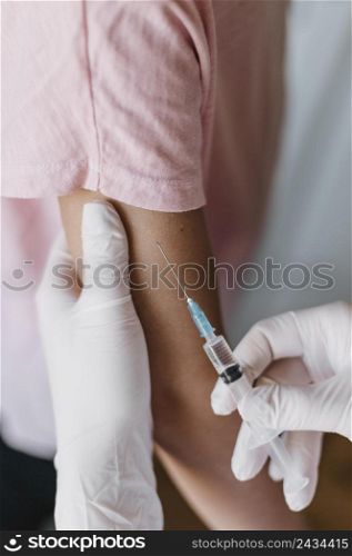 doctor giving kid vaccine