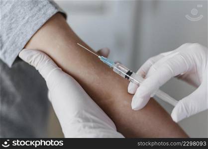 doctor giving little patient vaccine