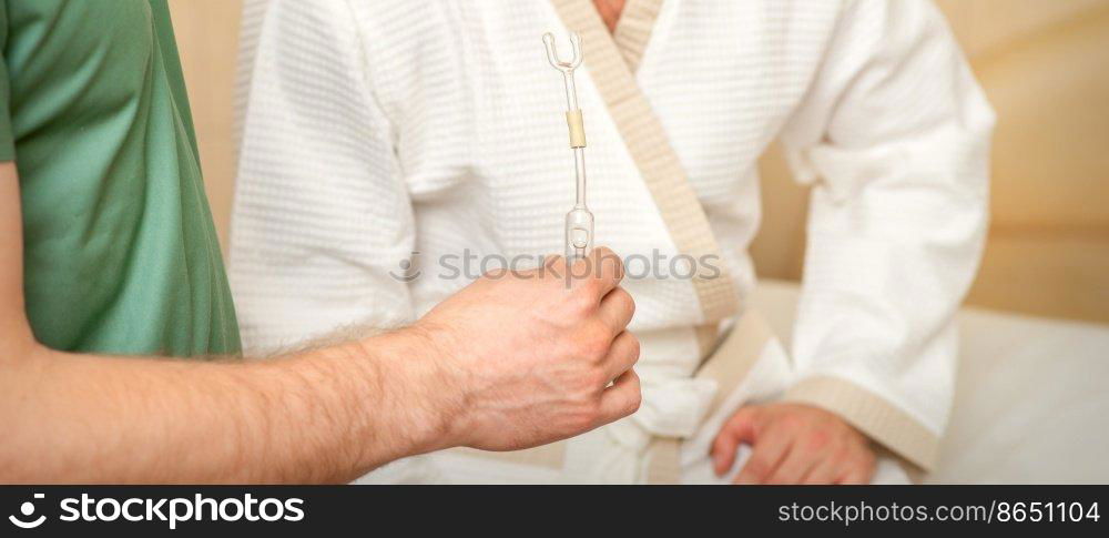 Doctor giving nasal inhalator with essential oil Maholda to a male patient in spa. Doctor giving nasal inhalator with essential oil Maholda to a male patient in spa.