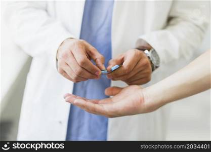 doctor giving pills