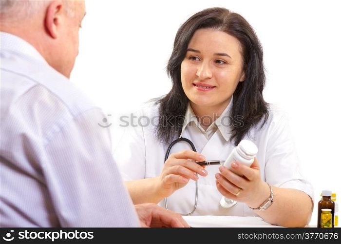 doctor giving the medicine to a senior man. . doctor giving the medicine to a senior man
