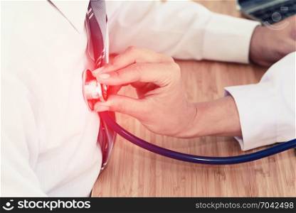 doctor hand holding stethoscope in front of patient chest, listen heartbeat, healthcare concept