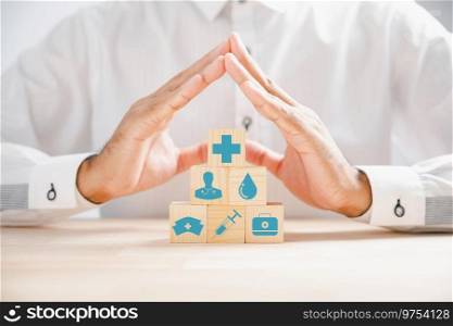 Doctor hand on a wooden cube block with a protection sign, symbolizing healthcare and insurance. Stacked medical icons on wooden cubes depict comprehensive medical services. Health care concept