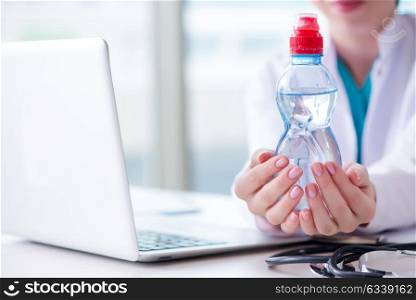 Doctor hand with fresh water in medical concept