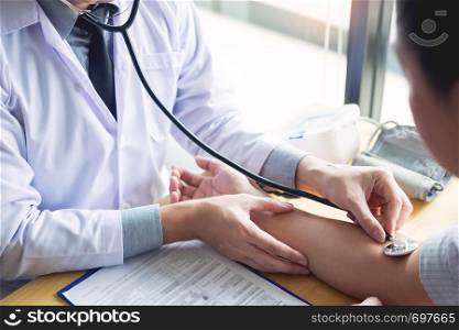 doctor hands checking blood pressure of a patient, Medical care concept