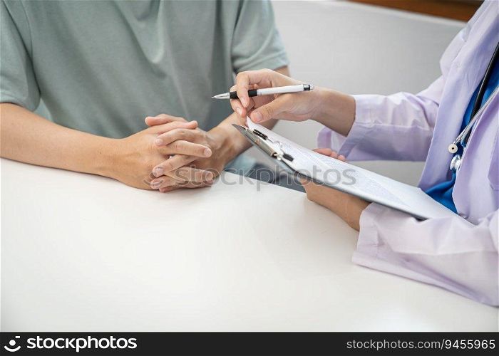 Doctor healthcare. Professional medical doctor in white uniform gown coat interview consulting patient reassuring his male patient helping hand.