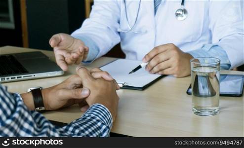 Doctor healthcare. Professional medical doctor in white uniform gown coat interview consulting patient reassuring his male patient helping hand.