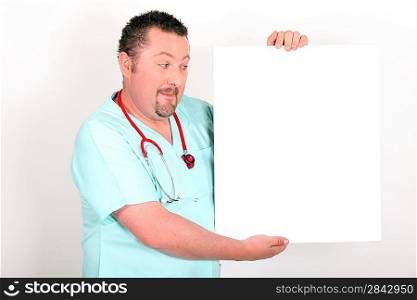 Doctor holding a blank sign
