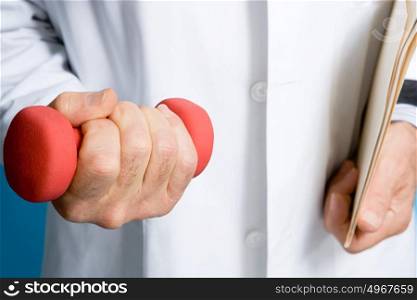 Doctor holding a dumbbell