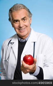 Doctor holding an apple