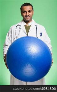 Doctor holding an exercise ball