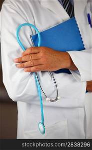 Doctor holding folder and stethoscope