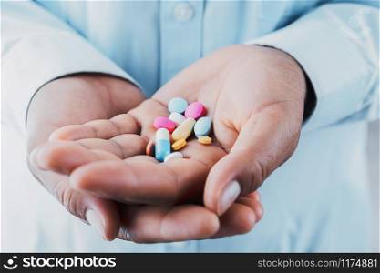 doctor holding medicine on hand. concept health care and medical