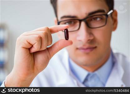 Doctor holding medicines in the lab