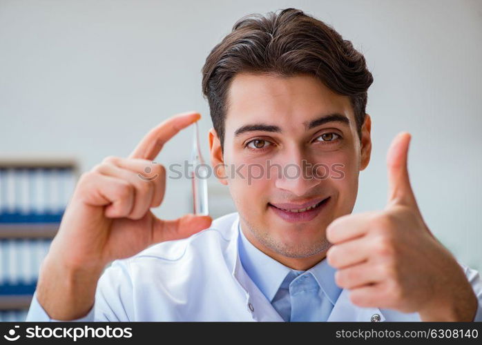 Doctor holding medicines in the lab