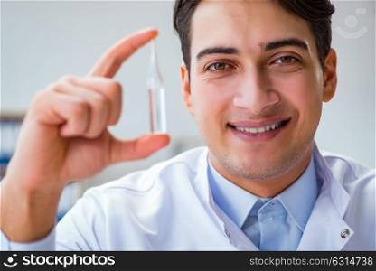 Doctor holding medicines in the lab