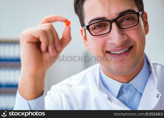 Doctor holding medicines in the lab