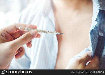 Doctor holding on thermometer for checking sick patient Health care in hospital