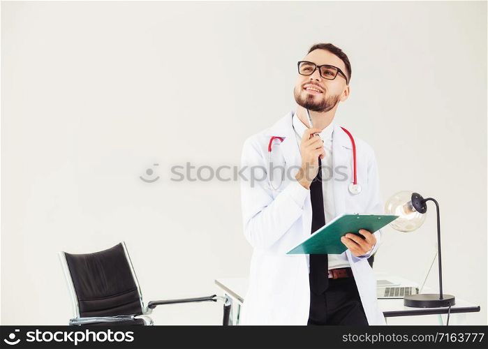 Doctor holding patients health file at office table in the hospital. Medical and healthcare concept.