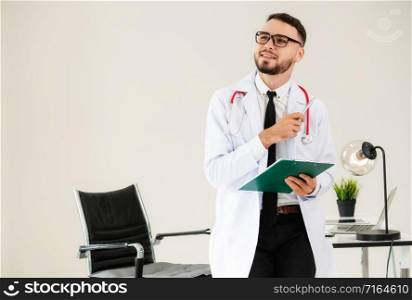 Doctor holding patients health file at office table in the hospital. Medical and healthcare concept.. Doctor holding patients health file in hospital.