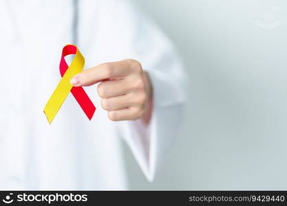 Doctor holding Red and Yellow ribbon. World hepatitis day awareness month, 28 July, Liver cancer, Jaundice, Cirrhosis, Failure, Enlarged, Hepatic Encephalopathy and Health concept