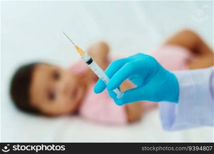 doctor holding syringe and preparing vaccine giving injection to infant baby