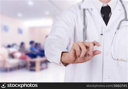 doctor holding syringe in hospital background