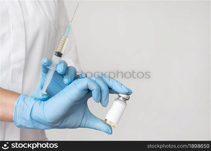 doctor holding syringe with vaccine. Resolution and high quality beautiful photo. doctor holding syringe with vaccine. High quality beautiful photo concept