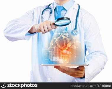 Doctor holding tablet pc. Close up of doctor&rsquo;s body holding tablet pc with media illustration