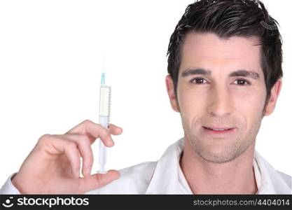 Doctor holding up an injection