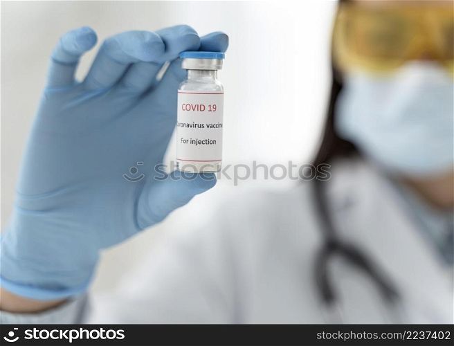 doctor holding vaccine recipient close up