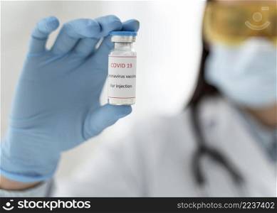 doctor holding vaccine recipient close up