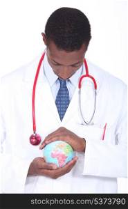 Doctor holding world globe