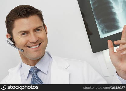 Doctor holding x-ray in hospital,portrait