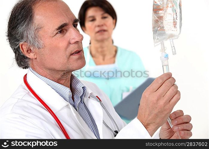 Doctor hooking up an IV